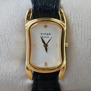 Titan Raga Ladies Wristwatch Gold Tone case Black Leather Strap Analog Watch